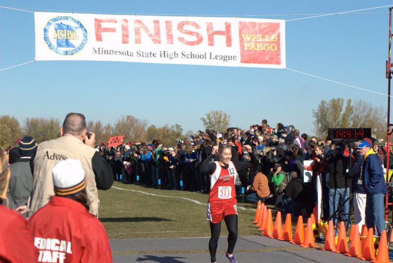 Emi Trost winning the state championship in cross country