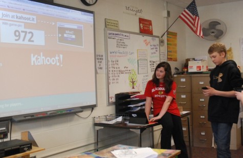 8th grade English students Grace Foster and John Tweidt work with Kahoot program