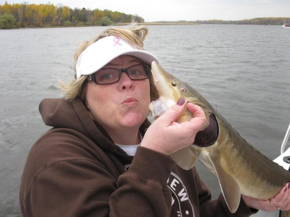  6th grade teacher Missy Klapperich snuggles up with her trophy fish