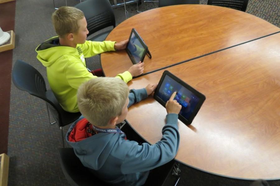 6th graders Riley Miller and Owen Edstrom check out their new tablets