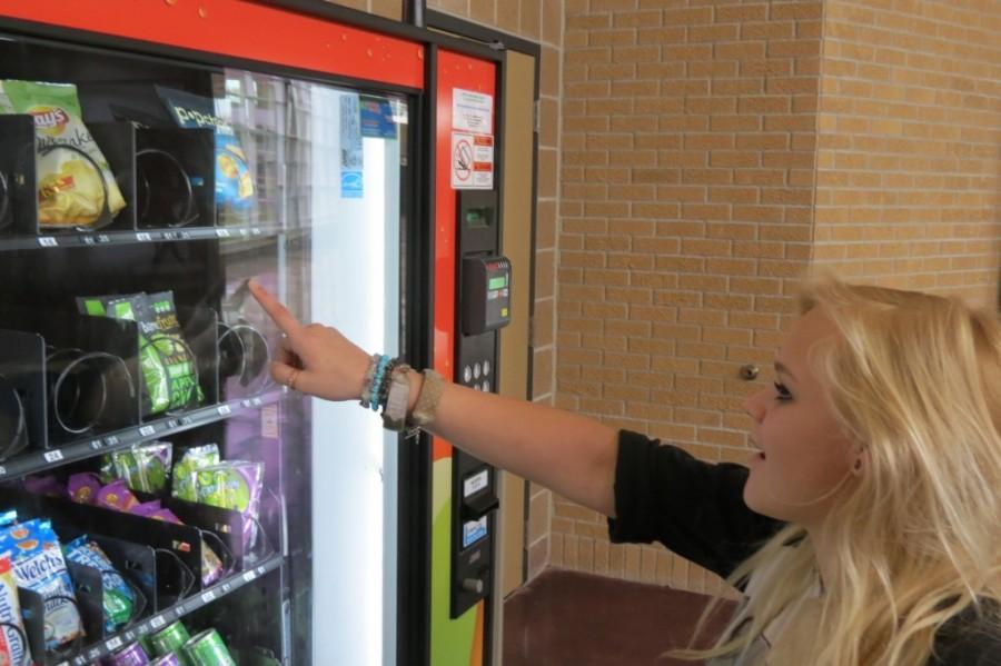 Paige Holt checks out the selection in the new healthy vending machine
