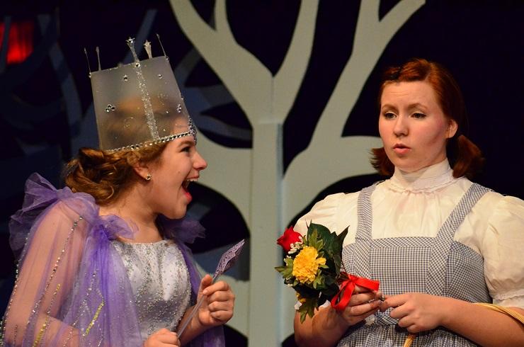 Mary Franz and Hannah Brummund share a moment on stage in the Wizard of Oz