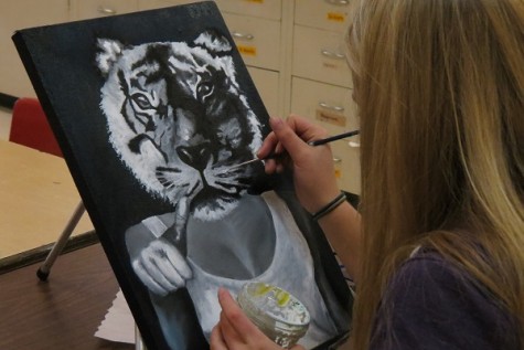 Carlson works on an independent art project