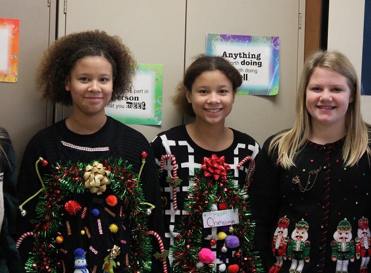 Middle school students show off holiday sweaters