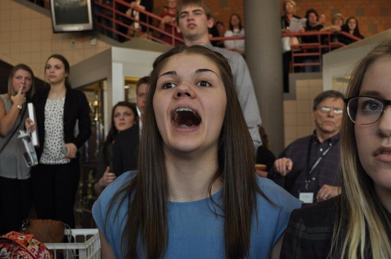 Emma Conway reacts to finals postings at the state speech tourney