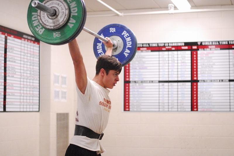 Logan Hofstedt practices for an upcoming weightlifting tournament.