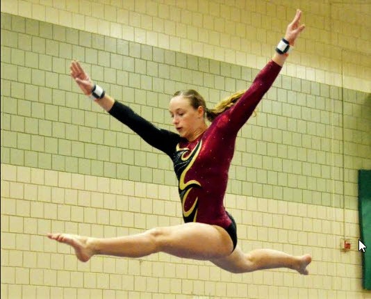 Ellie Stodden leaps above the high beam.