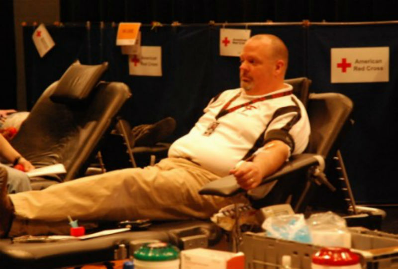 Principal, Mr. Hodges, relaxes while donating blood in the 2016 drive.