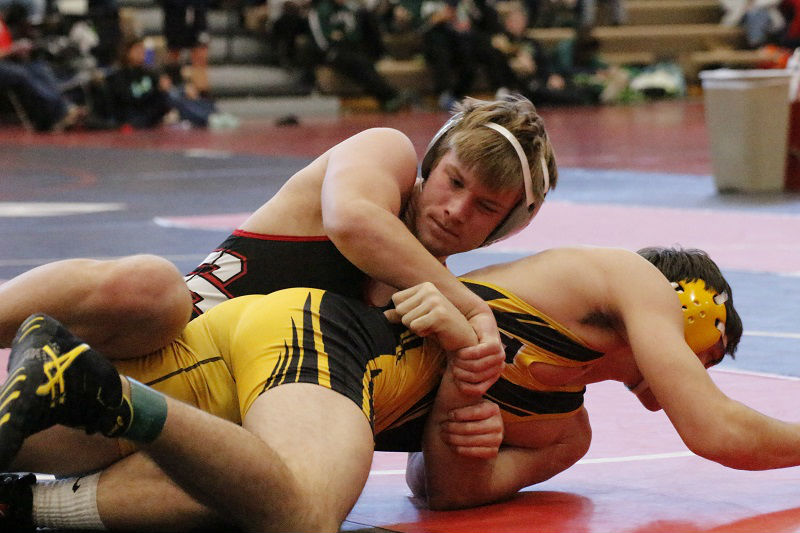 Hayden Strain locks onto his opponent in a struggle to win.