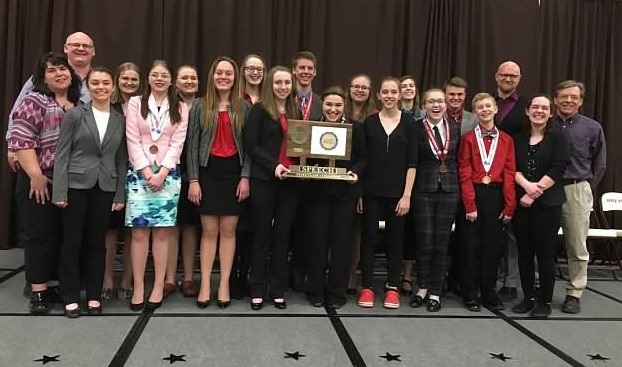 The state speech qualifiers line up for a picture with their latest championship trophy