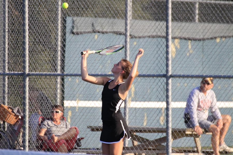 Iris French serves a game point to her opponents.