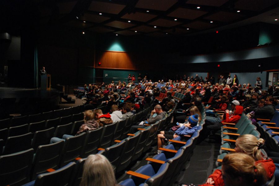 Students and parents join activities director, Jake Winchell, in the auditorium at the winter activities meeting.