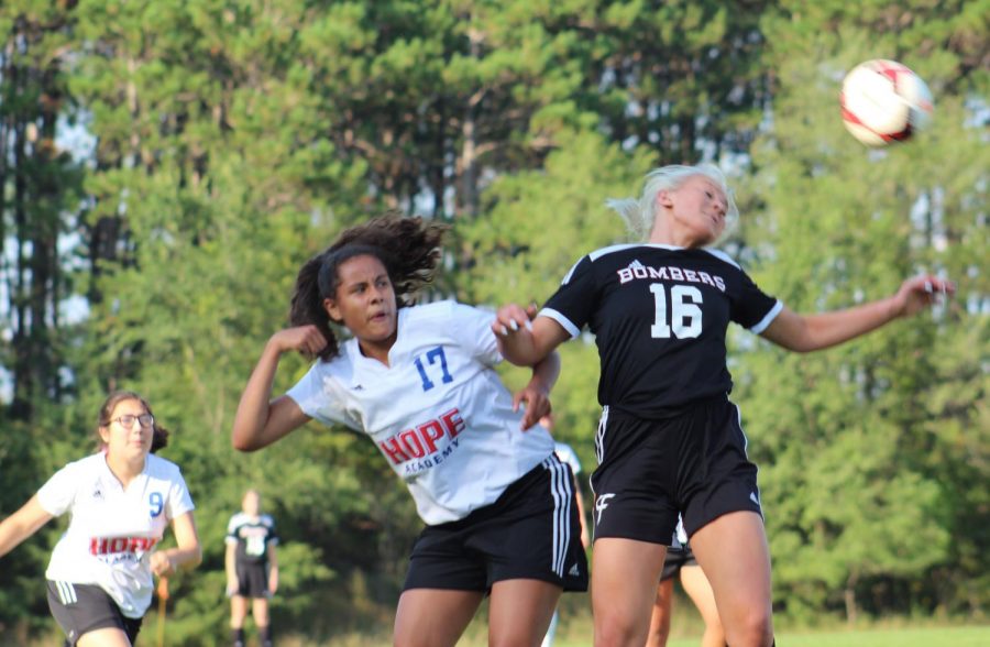 Kelsie Wilcox-Laurel controls the header for her team