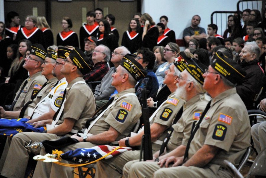 Veterans listen to speaker Jesse Johnson during the Veterans Day presentation