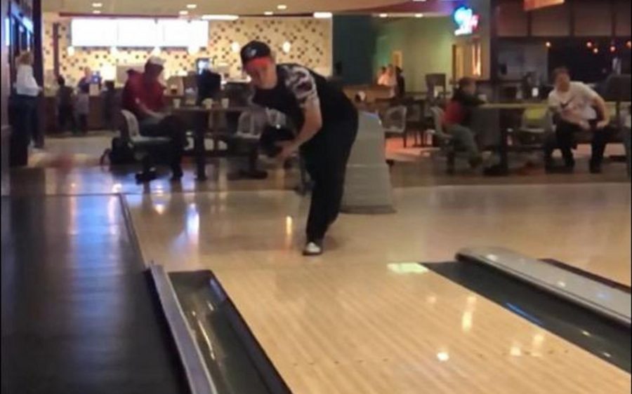 Parker concentrates as he is throwing the bowling ball.