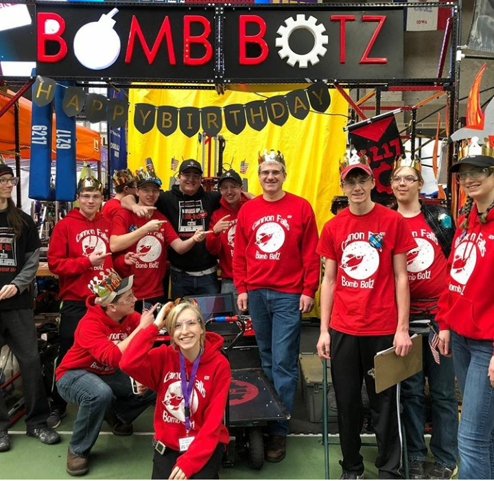 The Cannon Falls Bomb Botz posed with their robot at the Cedar Falls Regional tournament.