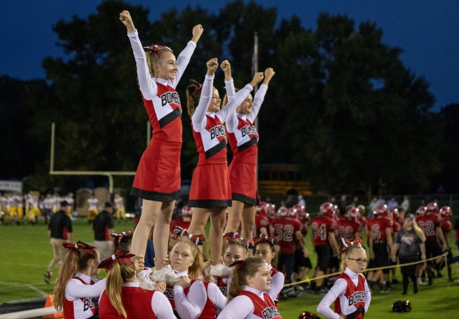 The cheer squad performing before fans at a recent home football game.