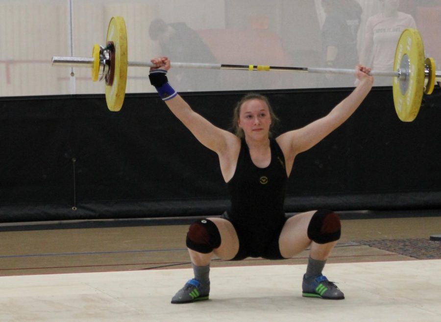 Senior Ellie Stodden concentrates on a lift at the home tournament.