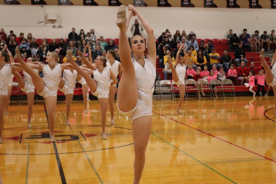 Varsity+Dancer%2C+Anna+Becker%2C+keeps+her+kicks+high+and+her+toes+pointed+during+the+BDTs+intense+kick+routine.