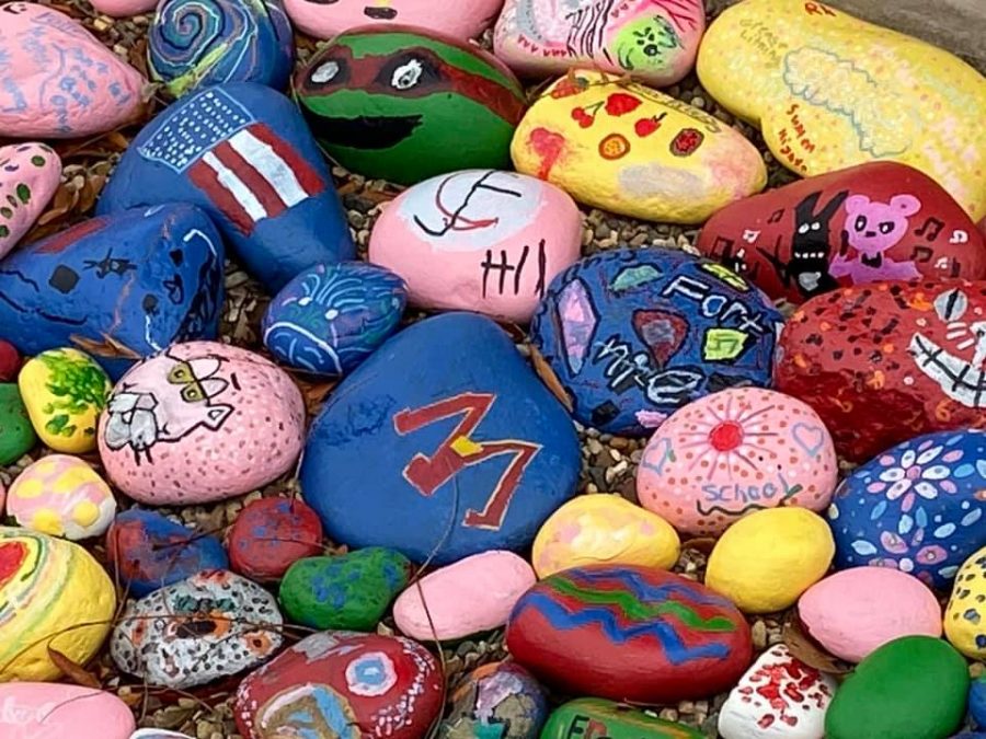 All of the small stones were painted by a variety of students, adding color in front of the elementary school.