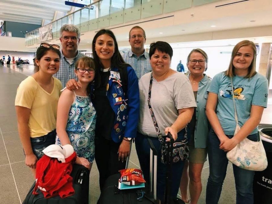Eden Walson (middle), smiled for one last U.S. photo at the Minneapolis-Saint Paul International Airport in 2018 with her two host families: the Conways (left) and the Johnsons (right). 