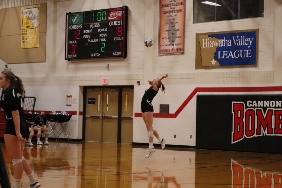 Madison Burr spikes a storm at the Lake City team.