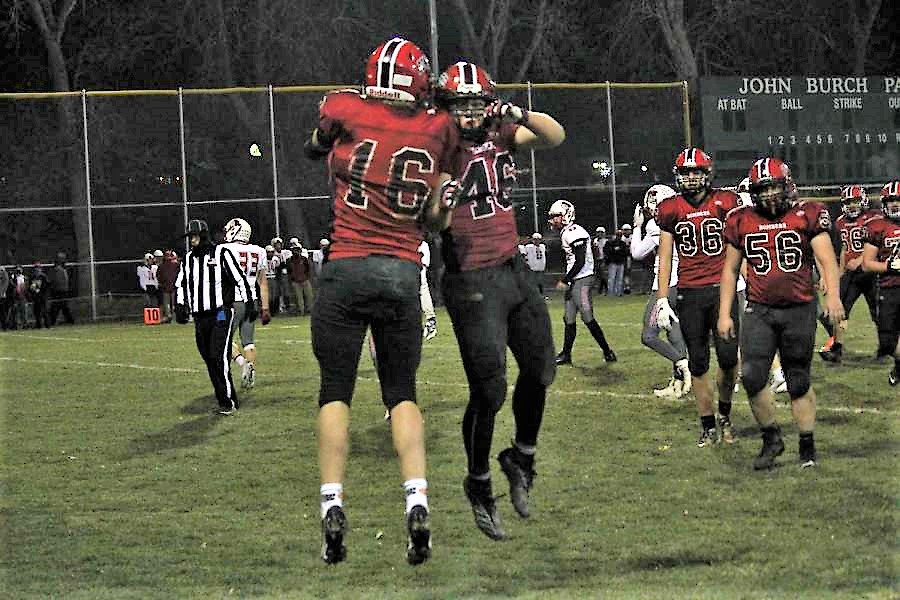 Marcus+Banks%2C+number+16%2C+and+Beau+Zimmerman%2C+number+46%2C+celebrate+a+touchdown+during+the+Section+Championship+game.