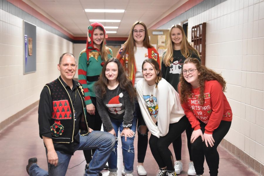 Students+and+teachers+pose+for+an+ugly+sweater+day+picture.