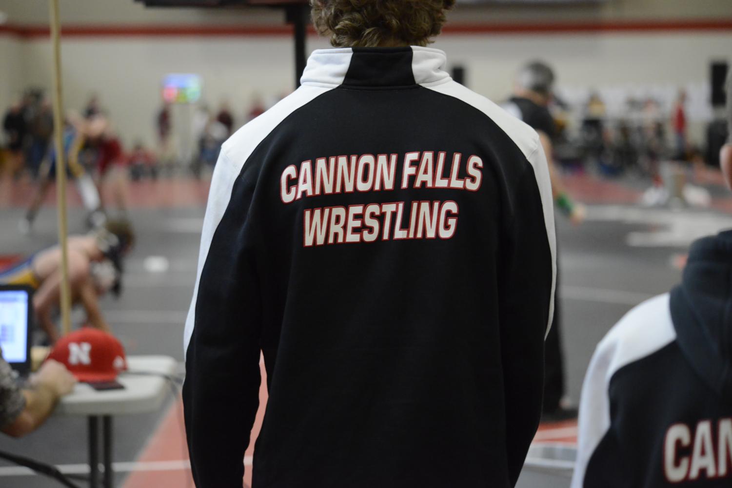 One of the Cannon Falls wrestlers watches his teammates match. 
