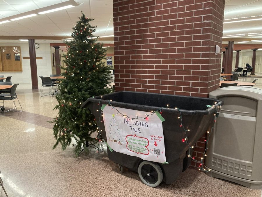 The Giving Tree donation bin can be found in the atrium, bedecked with strings of lights and an ornament-covered tree.
