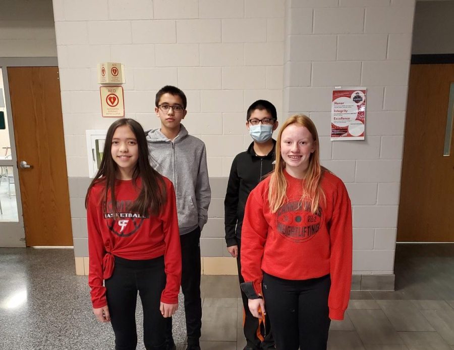 Math League members Charles Fick, William Zheng, Amelia Fick, and Riley Iverson pose for a picture.