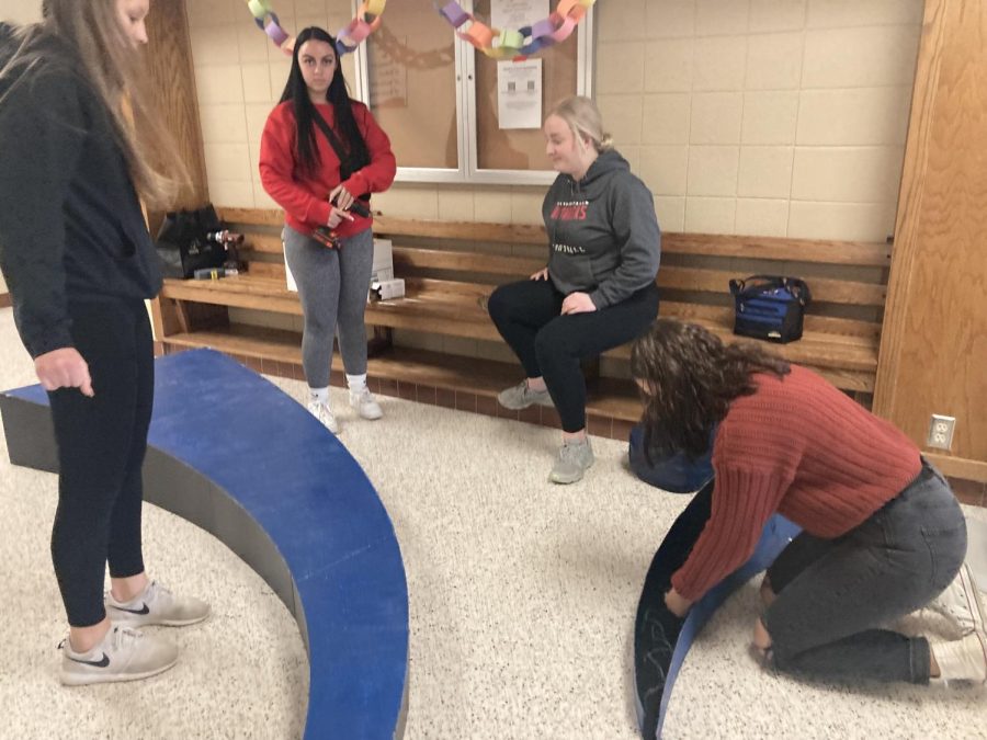 Members of the CFHS Prom Committee diligently work on decorations for prom.