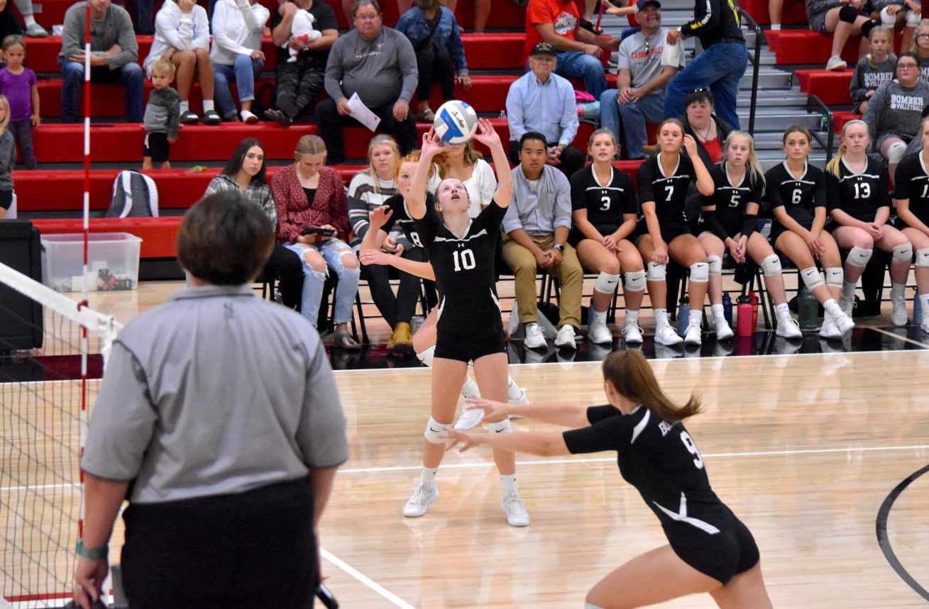 Falon Hepola sets the ball to her teammate for a kill. 