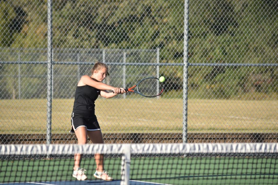 Josie Sjoquist smacks a backhand at her opponent from Cotter.
