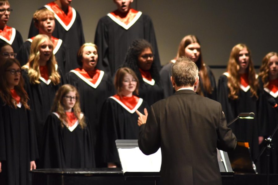Peter Duggan conducts the choir at his first concert as director.