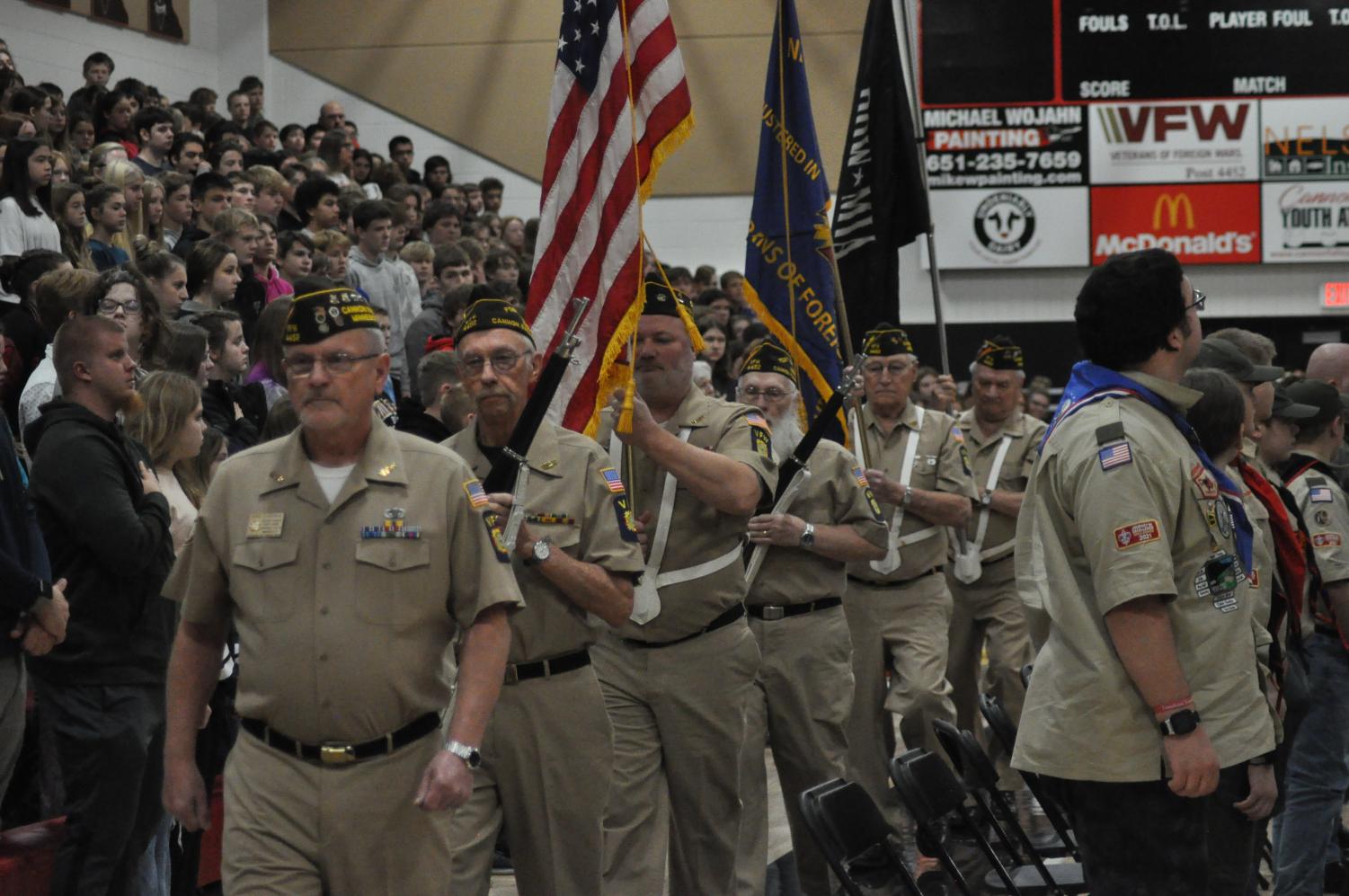 Following the Veterans Day ceremony the VFW Color Guard parades out of the gymnasium