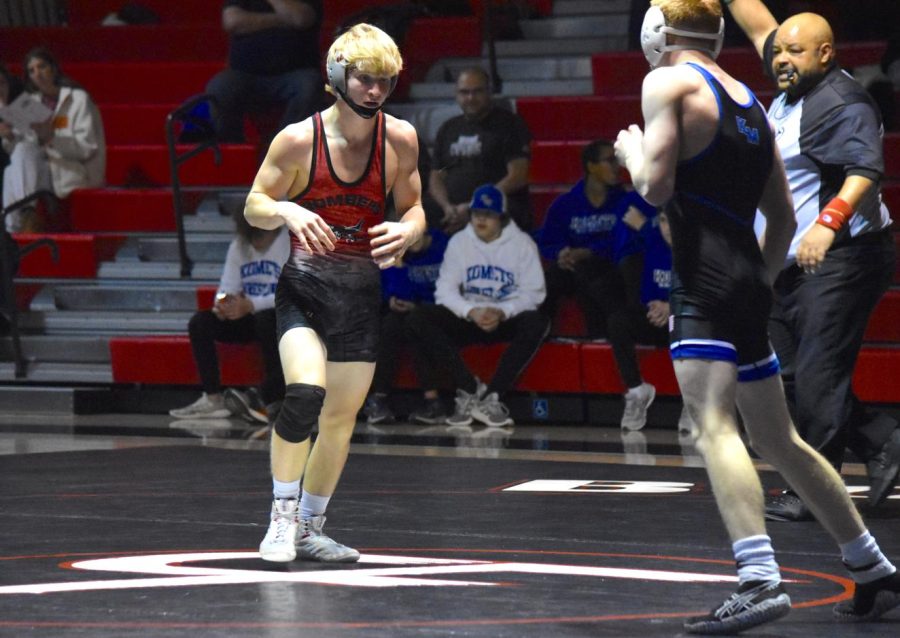 Gavin Peterson faces his opponent during a match at Cannon Falls High School.