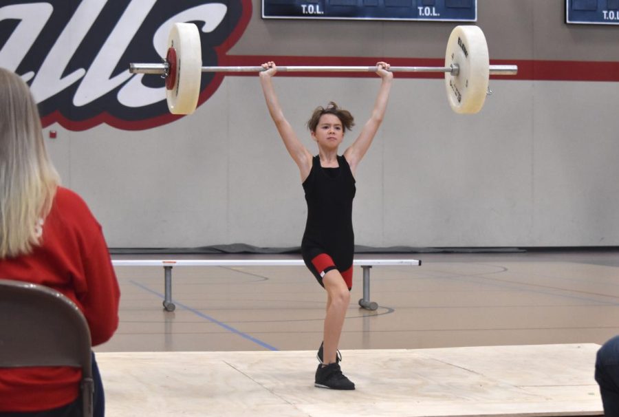 6th grader, Beatrix Wagner gracefully ends her clean and jerk at 20 kilos.
