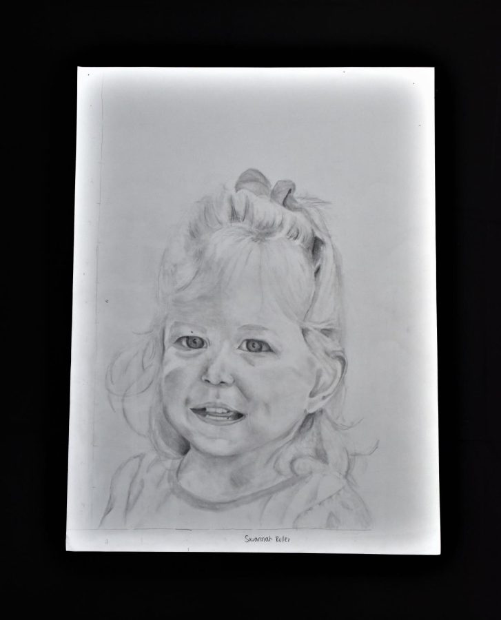 Savannah Roller drew this impressive portrait of a small child with graphite pencils.