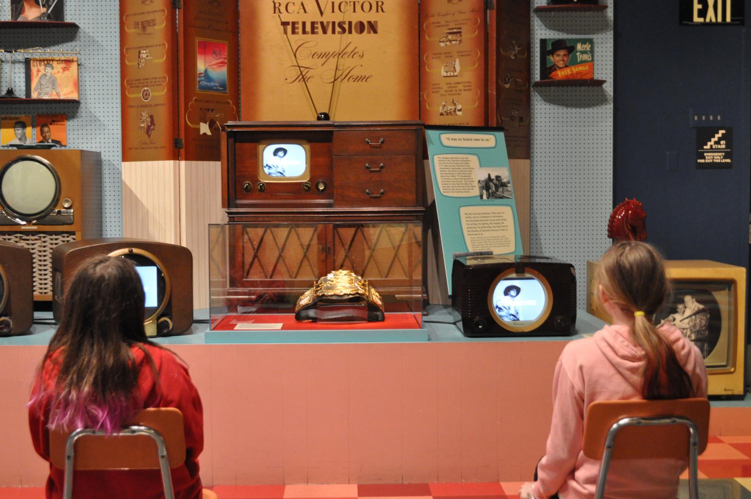 Roni Campbell and Anya Nygaard take in displays of early 20th century video artifacts