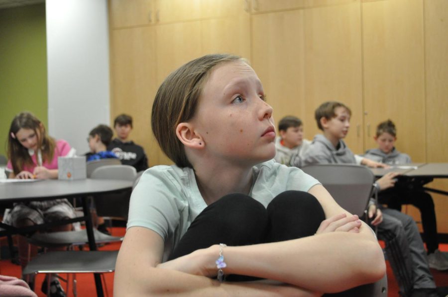 Anya Nygaard listens carefully to a presentation at the museum.