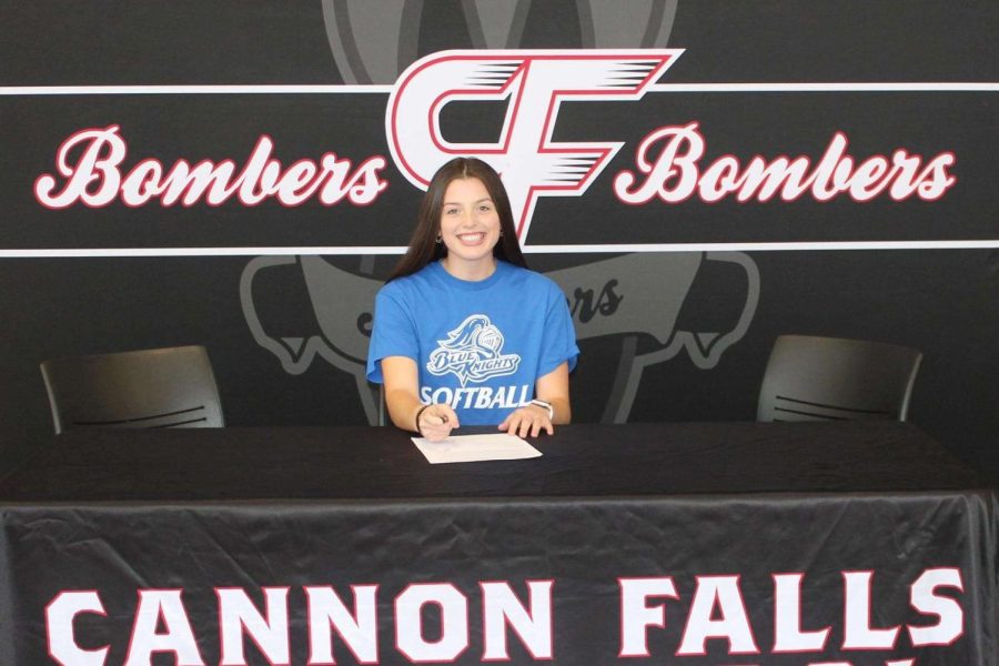 Chloe Lingelbach smiles after signing with DCTC to play softball. 