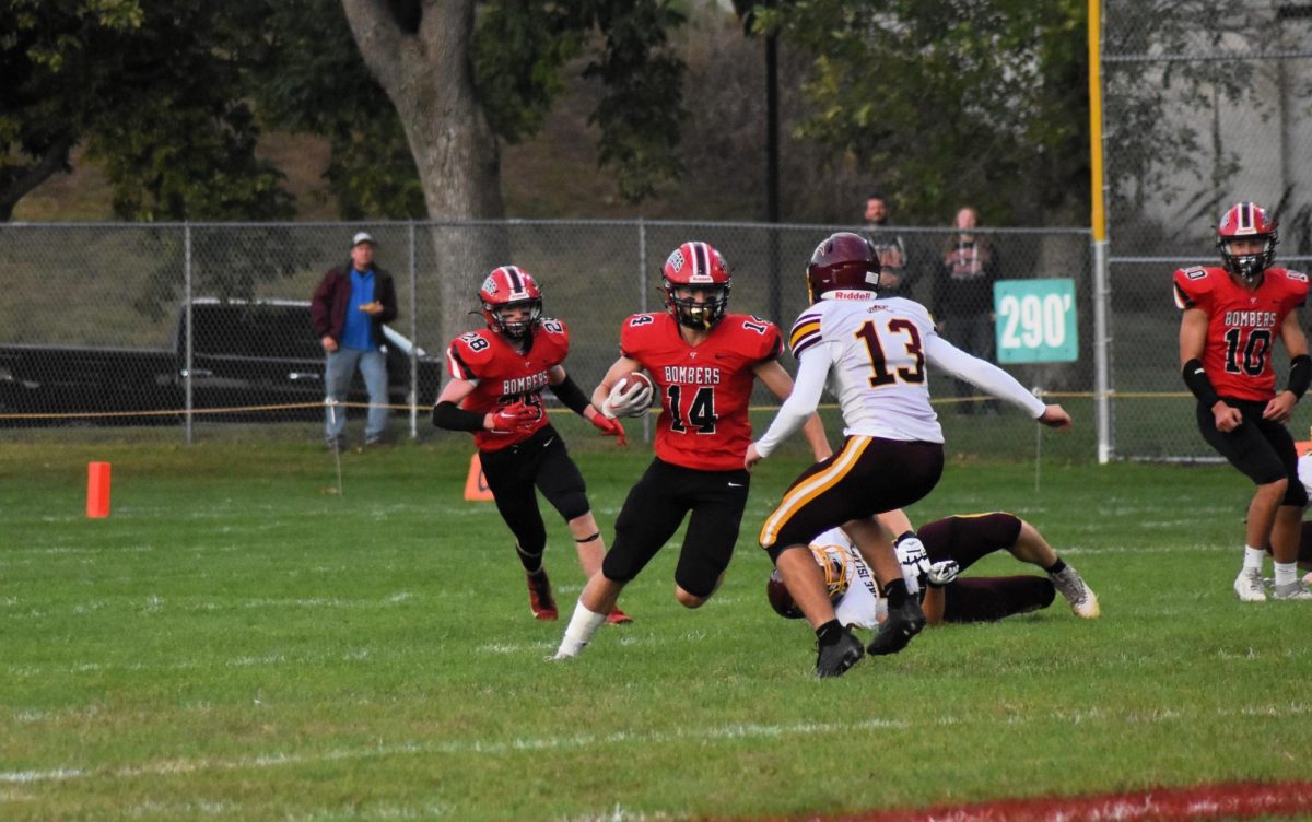 Jack Meyers fakes out an opponent on the way to a big gain in yards.