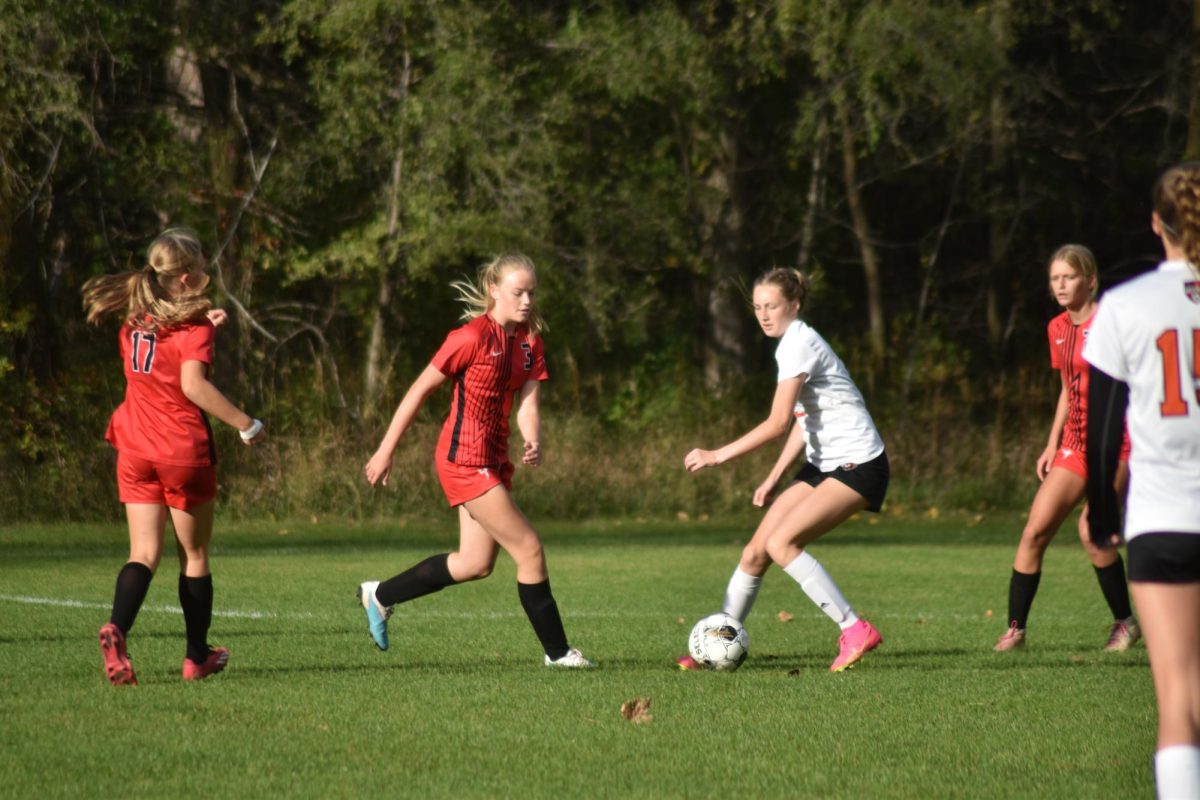 The Girls soccer team battles for the ball.