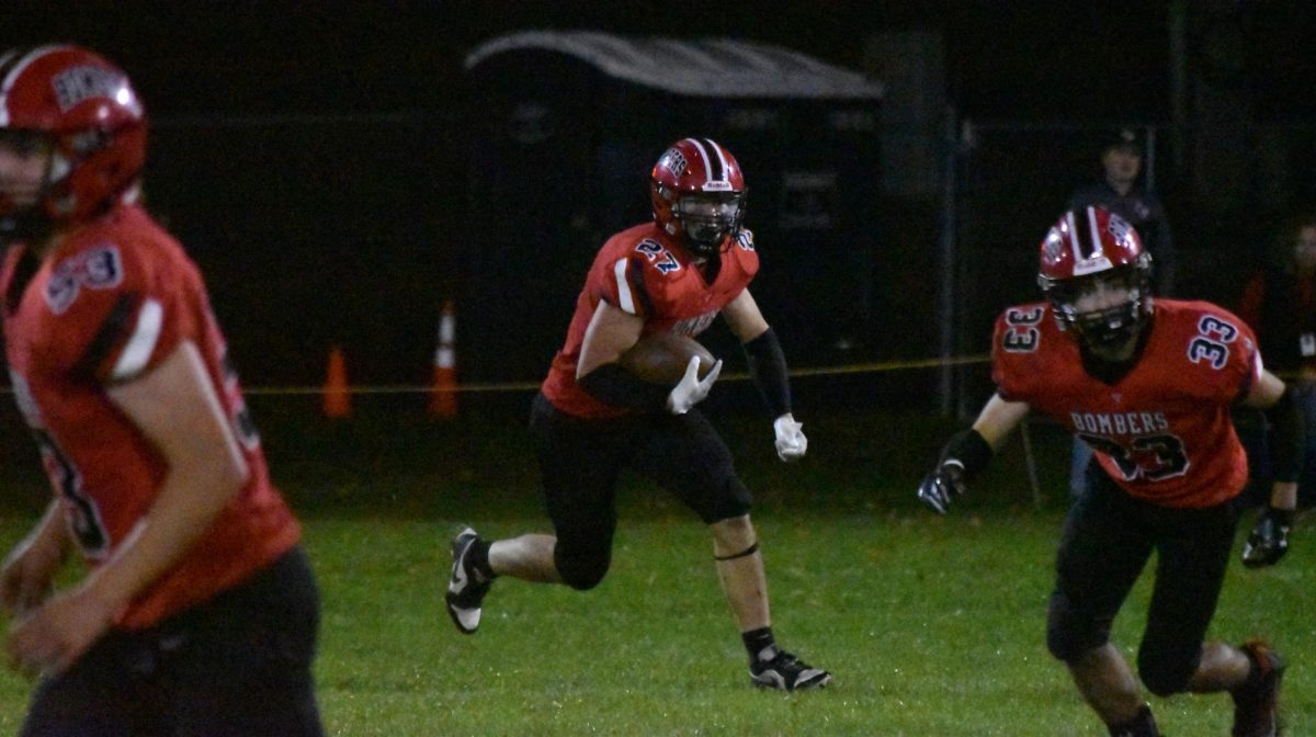 Dylan Banks races towards the end zone with the ball. 