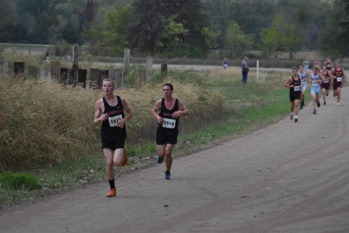 Two Cannon Falls runners separate from the pack during their race.