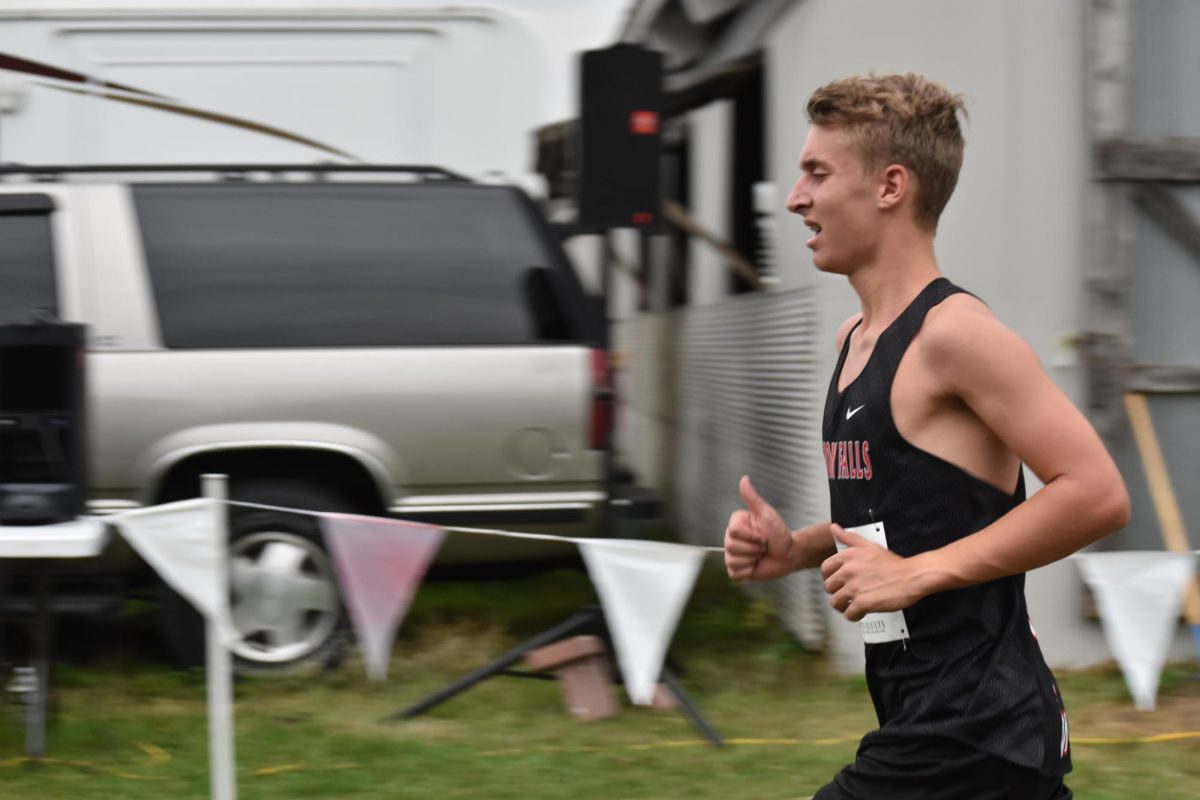 A Cannon Falls runner smiles during the race.