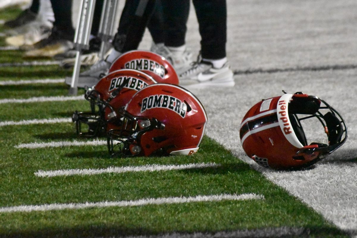The Bombers lay their helmets on the sidelines after a record breaking win. 