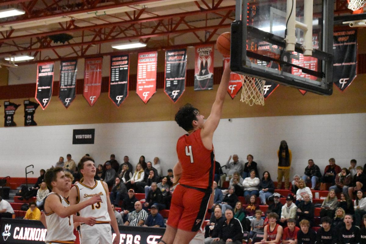 Aiden Johnson pushes his teammates shot into the basket.