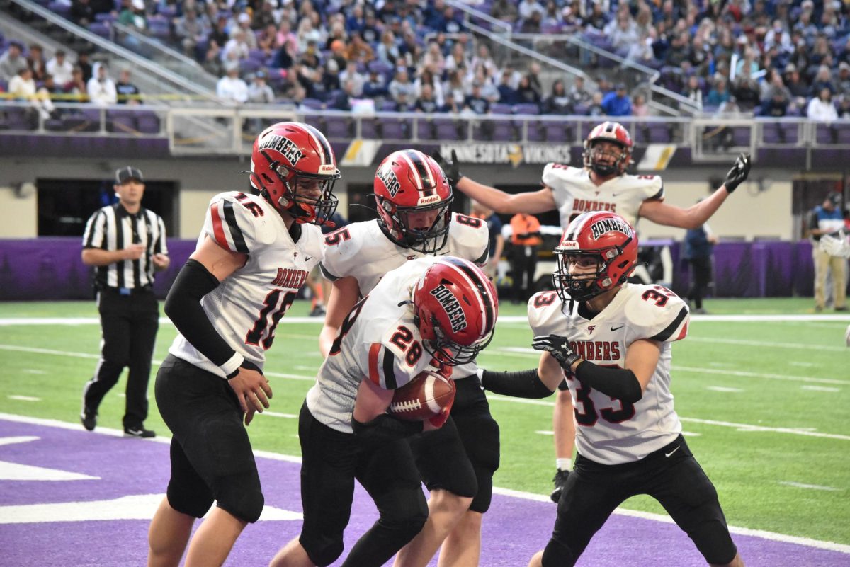 The football team celebrates after scouring a touchdown.